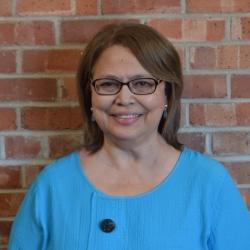 Headshot of Evangeline Aguilera, Ed.D. the Educational Leadership Coordinator for the Center for Educational Leadership and Tomorrow’s Leaders Program