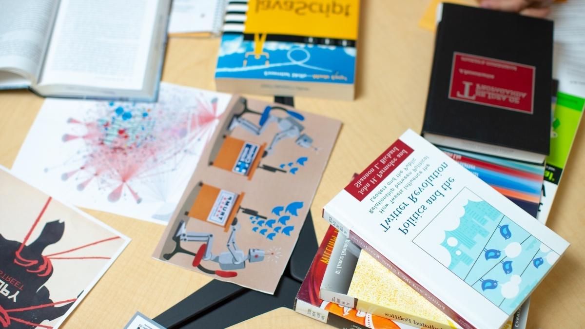 Desk covered in text books.