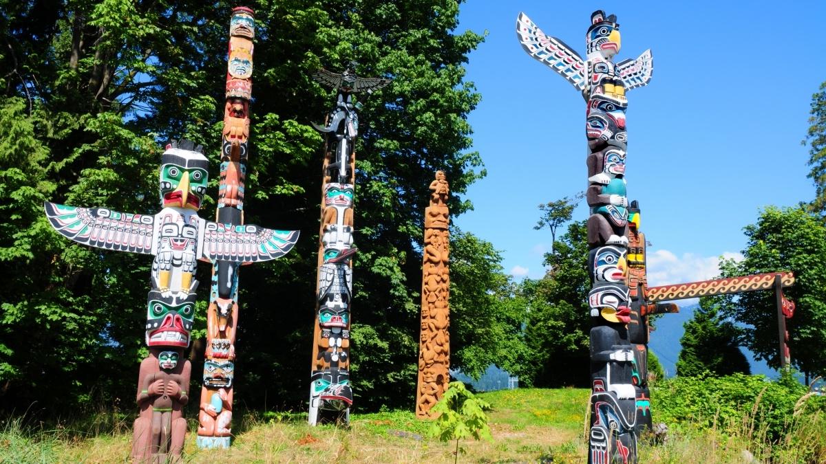 Native American idol statues in an open field